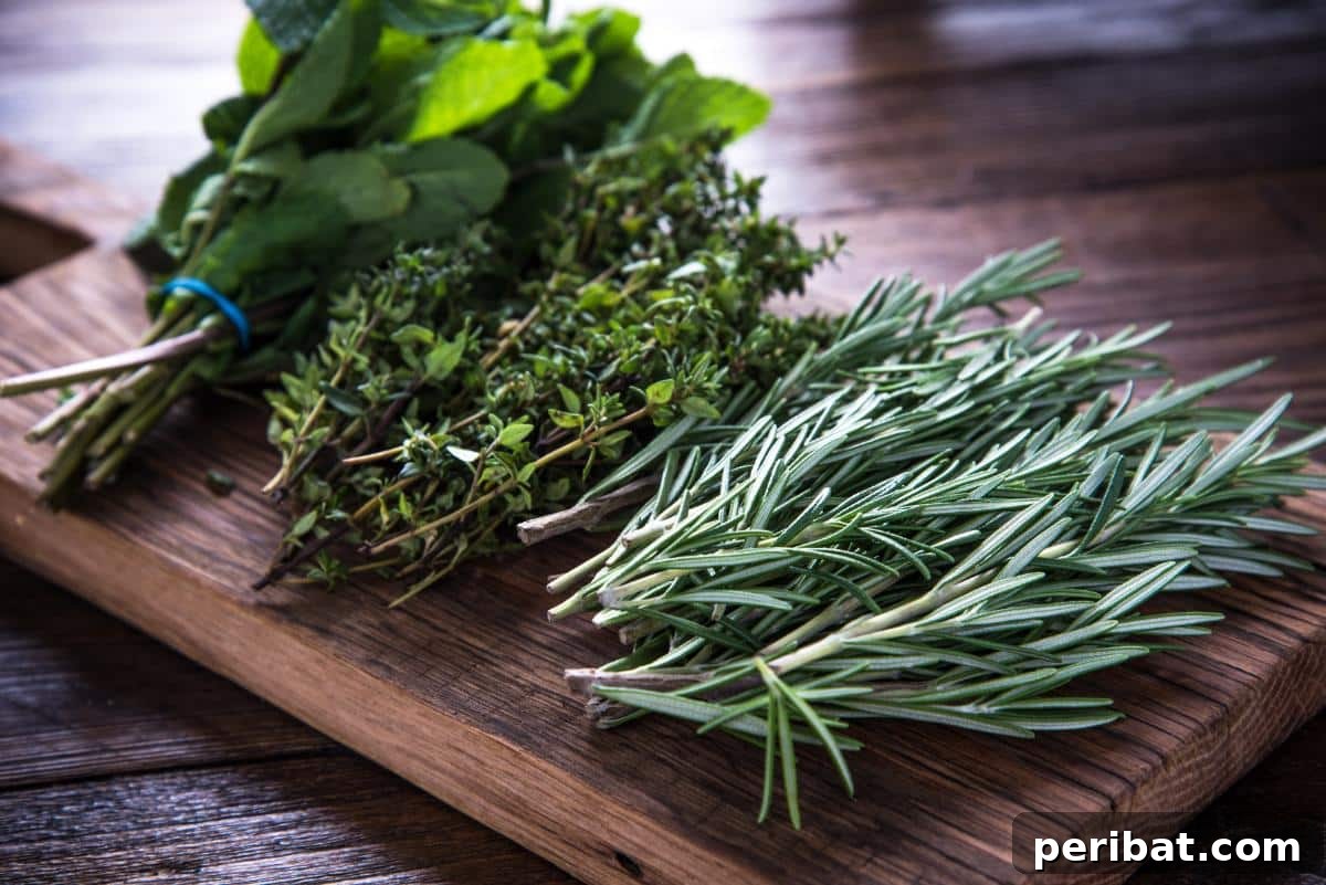 Bundles of fresh herbs on a wooden cutting board, suitable for preserving their flavor by freezing them in oil or broth.