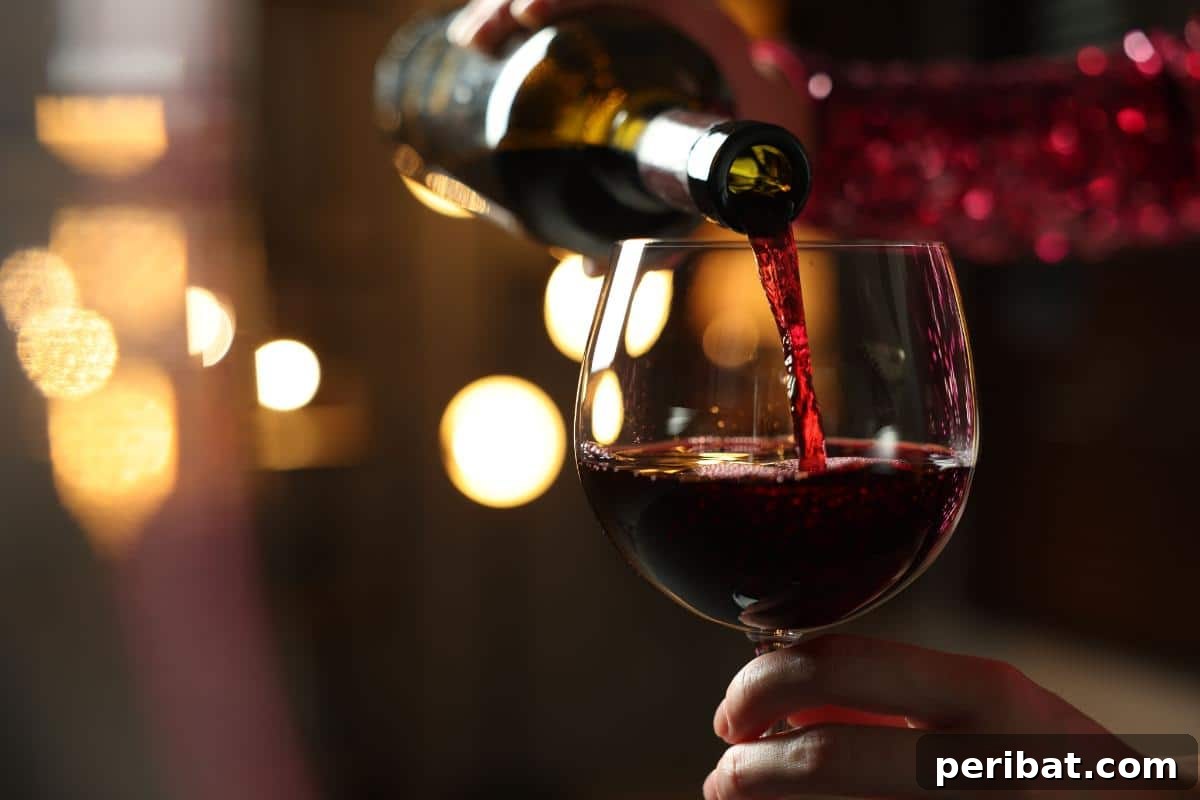 Pouring wine into a glass, indicating that any leftover wine can be frozen for various culinary uses.