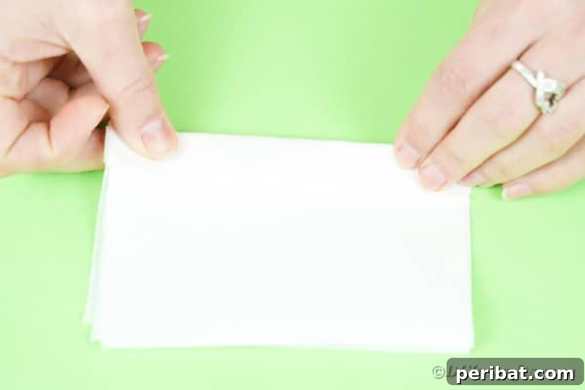 Folding white paper like a fan