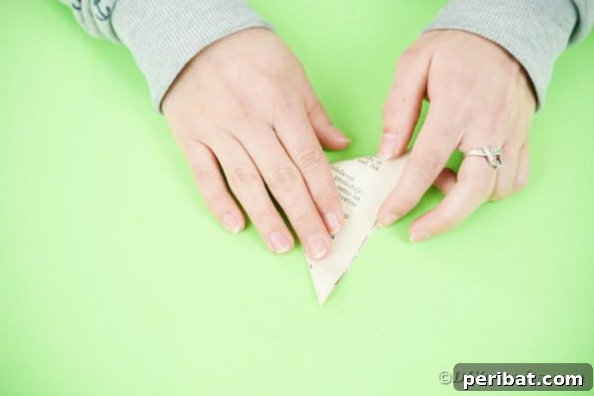 A book page triangle folded in half again
