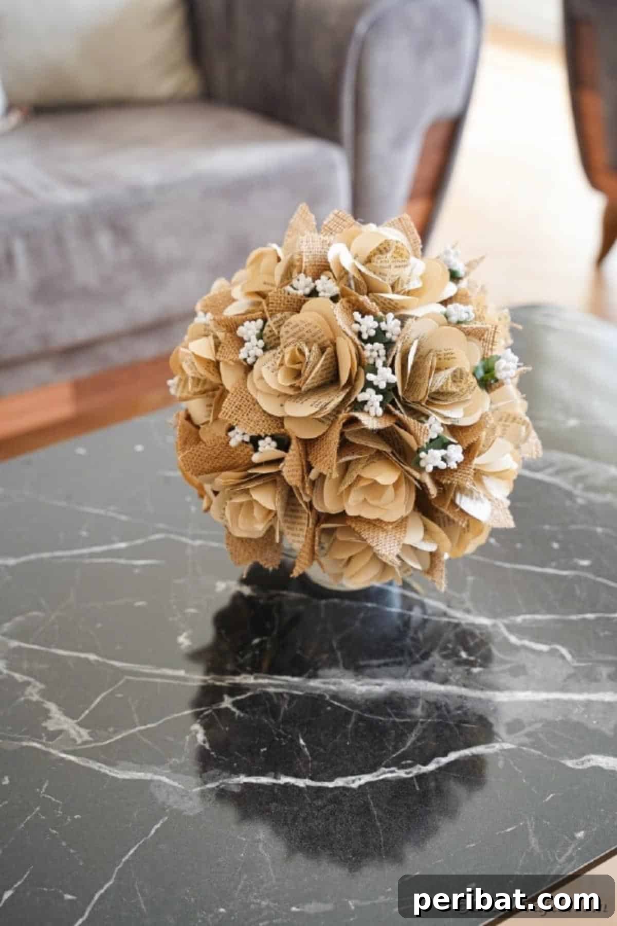 Beautiful paper rose flower bouquet made from old book pages, displayed on a coffee table