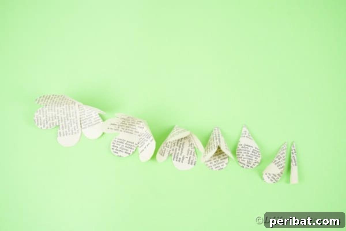 Various formed paper flower pieces arranged on a table