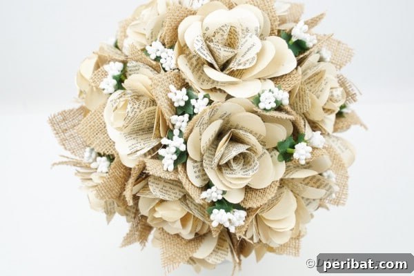 Old book page rose bouquet on white table, showcasing intricate details
