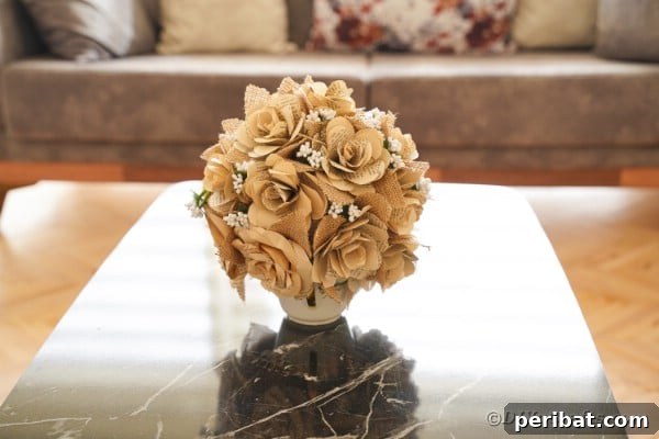 Paper rose flower bouquet made from old book pages on a coffee table