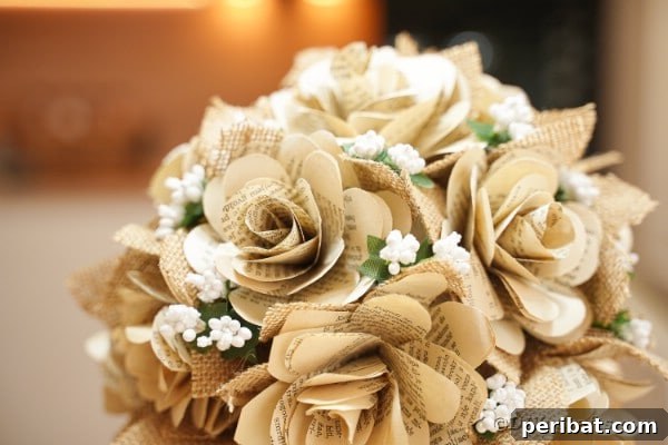 Book page rose bouquet on a dark wooden table as a centerpiece