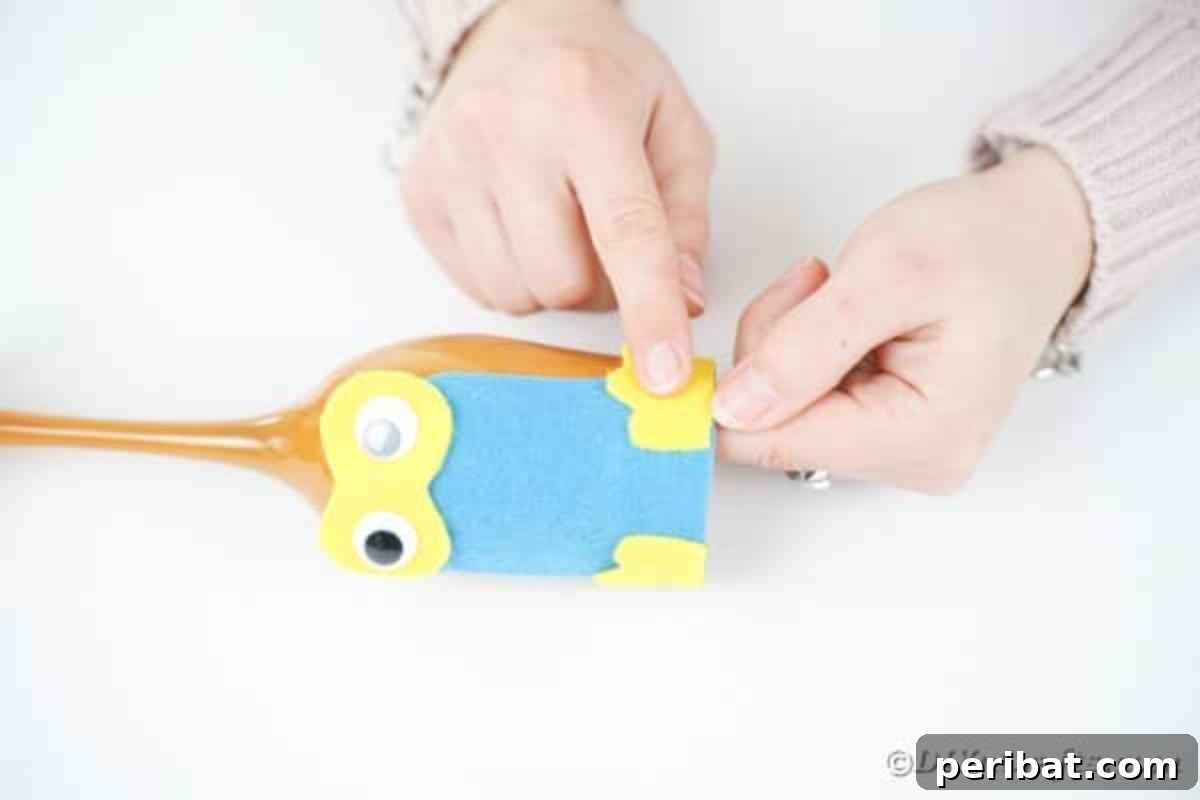 Craft Your Own Adorable Wine Glass Owl 15 Gluing feet onto wine glass owl