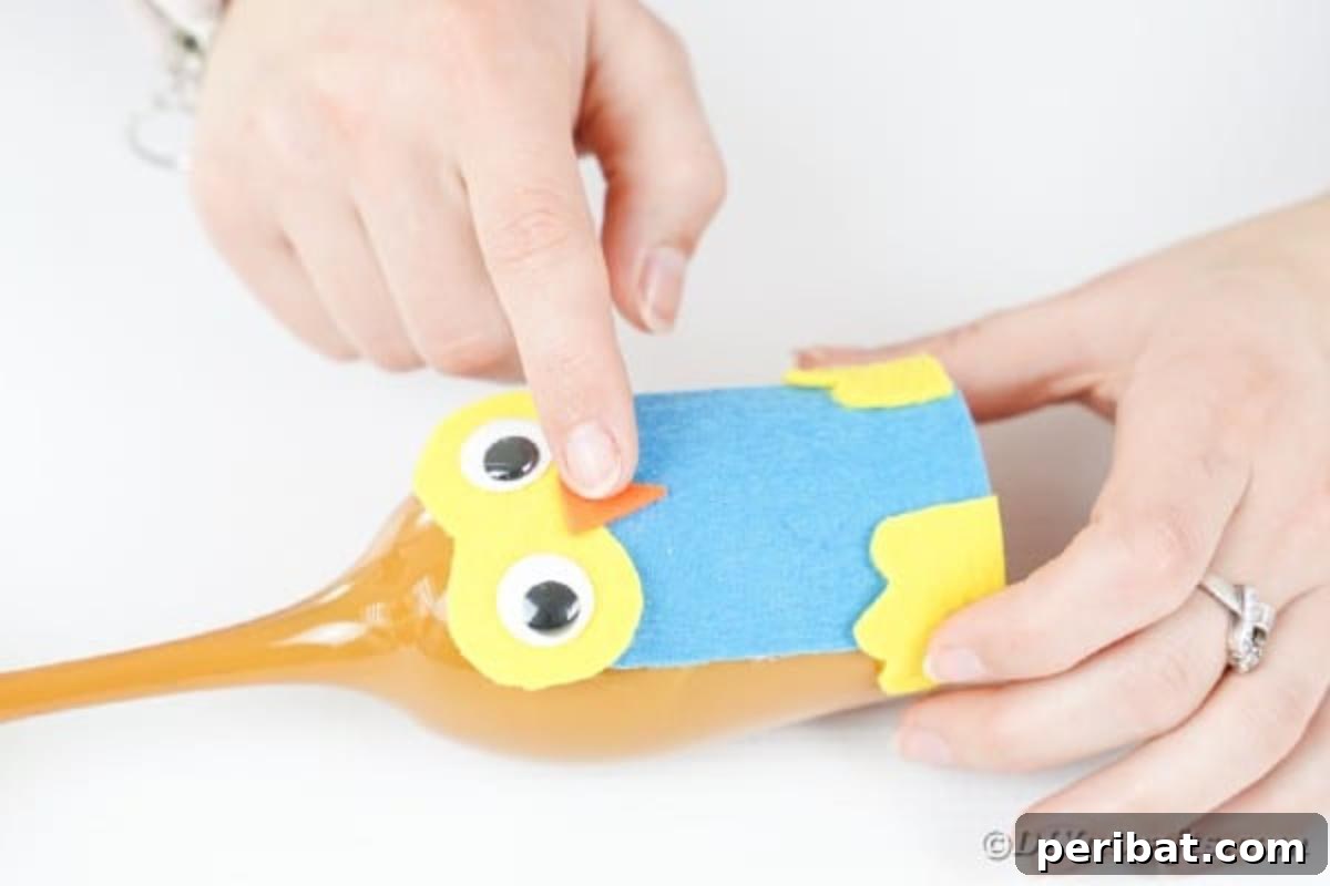 Craft Your Own Adorable Wine Glass Owl 16 Gluing beak to owl
