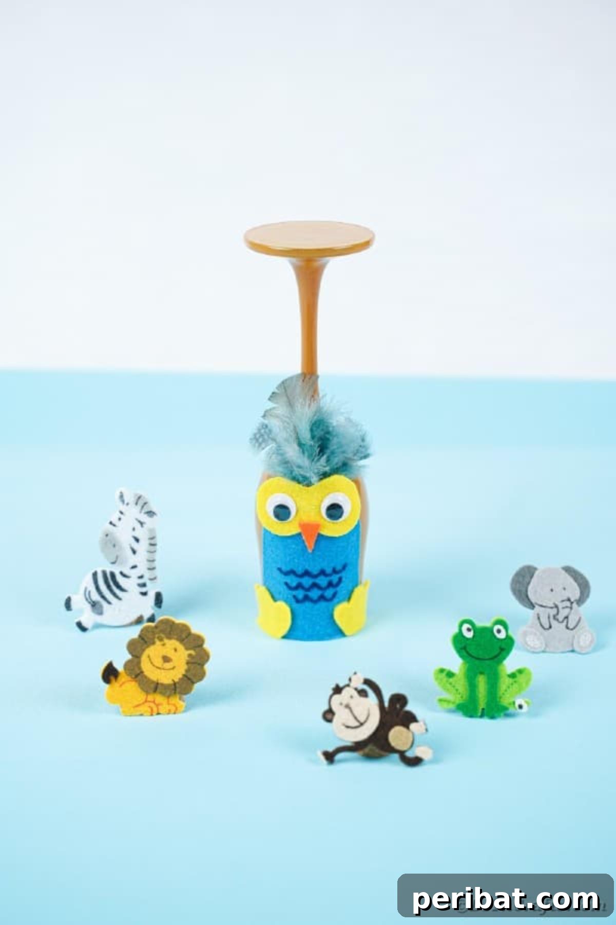 Craft Your Own Adorable Wine Glass Owl 3 Wine glass owl on blue table