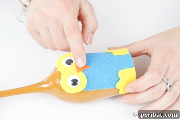 Craft Your Own Adorable Wine Glass Owl 29 Gluing beak to owl