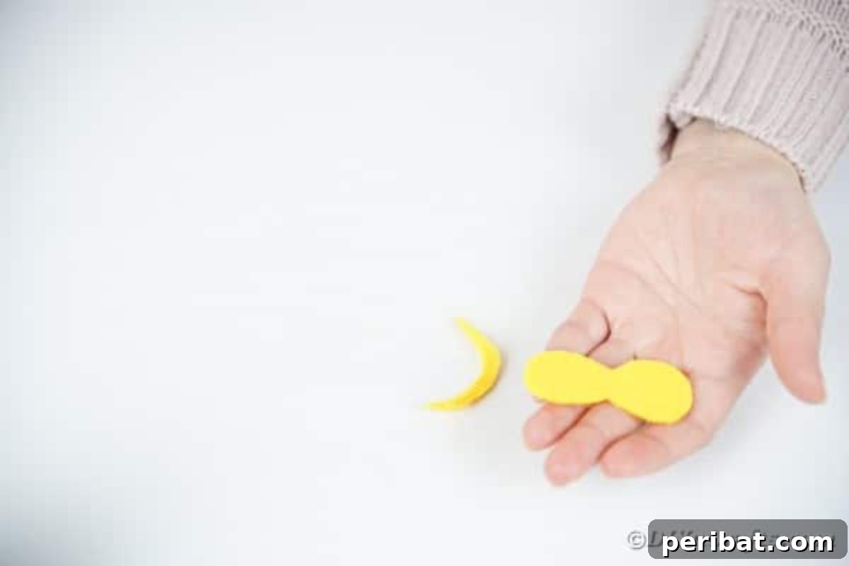 Craft Your Own Adorable Wine Glass Owl 10 Cutting eyes out of yellow paper