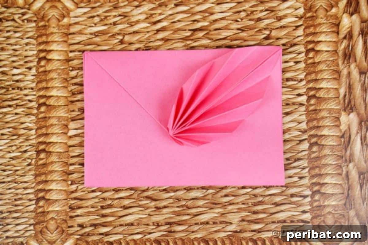 Elegant Origami Envelopes: A DIY Paper Craft Video Tutorial 17 Origami envelope on woven mat
