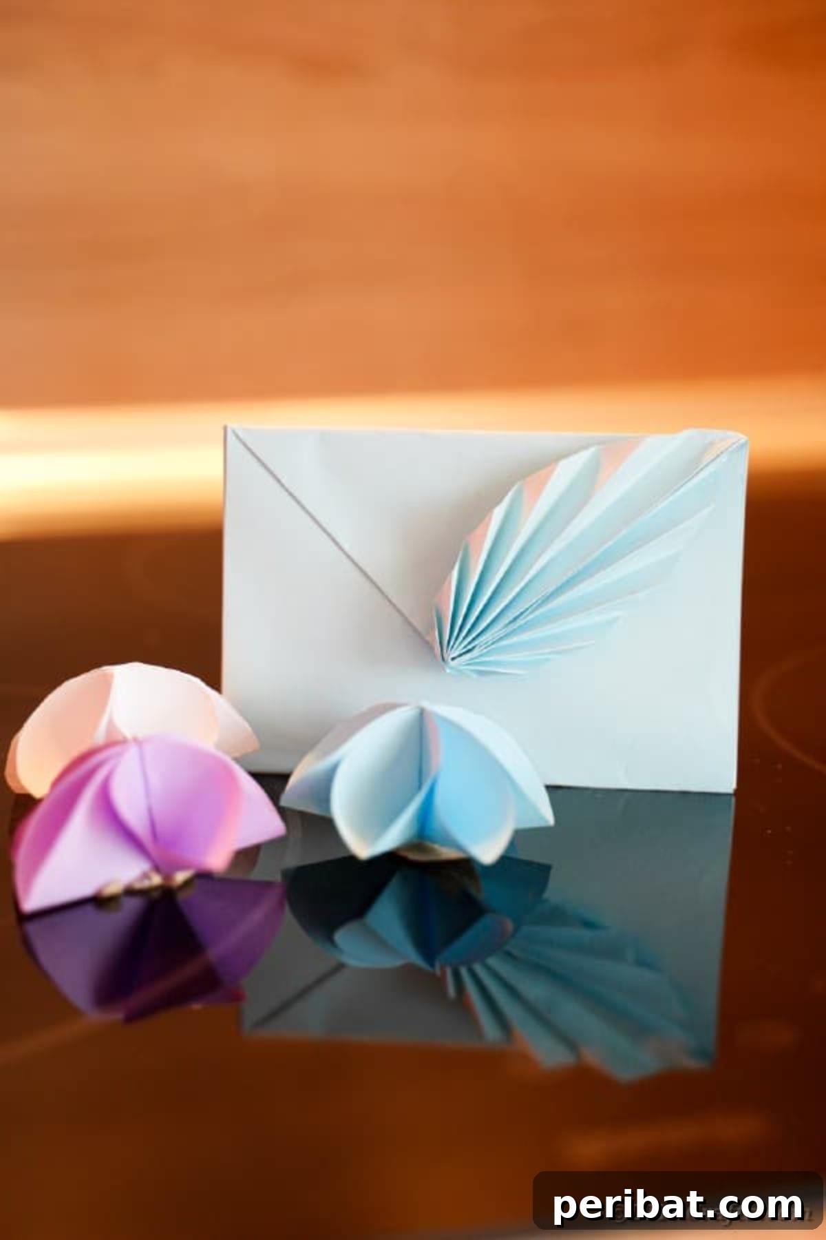 Elegant Origami Envelopes: A DIY Paper Craft Video Tutorial 3 Origami envelope on wooden surface