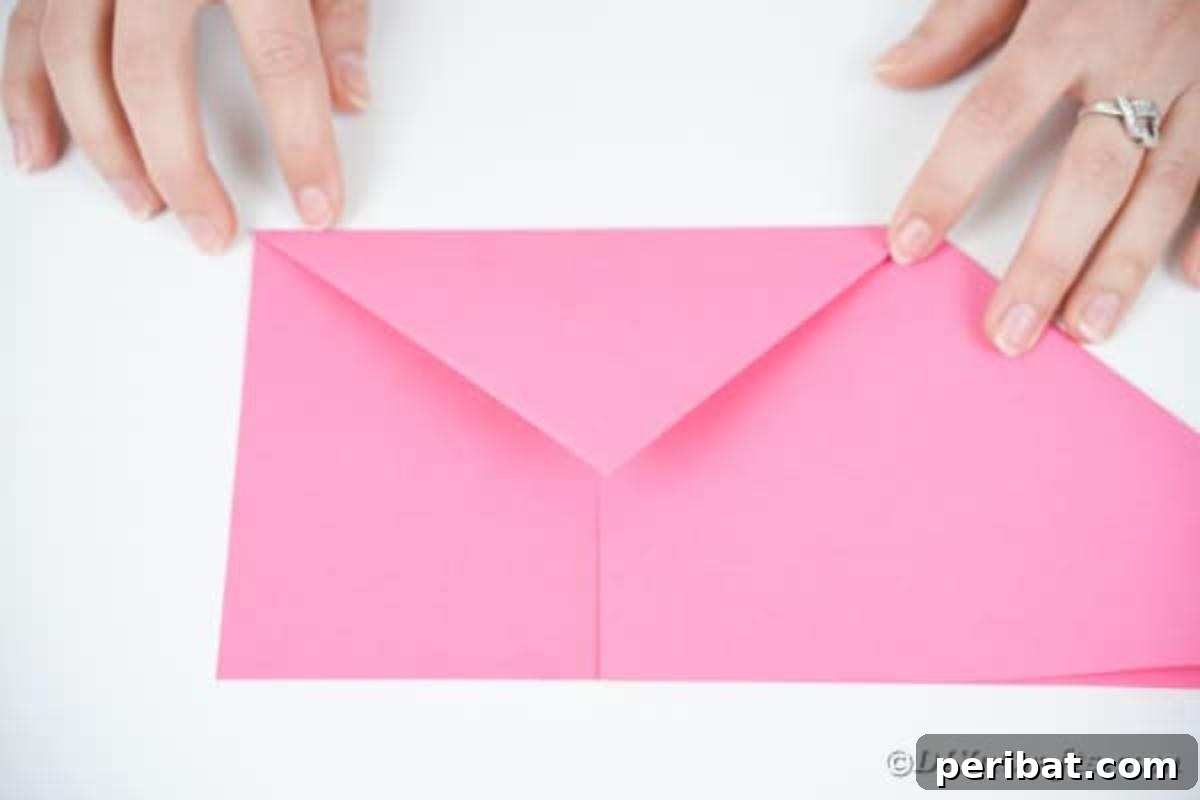 Elegant Origami Envelopes: A DIY Paper Craft Video Tutorial 10 Folding over envelope flap of paper