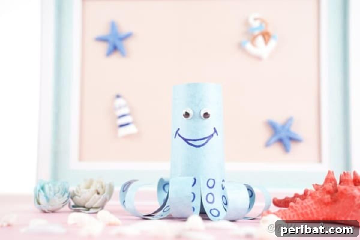 Crafted blue paper octopus positioned in front of a collection of seashells