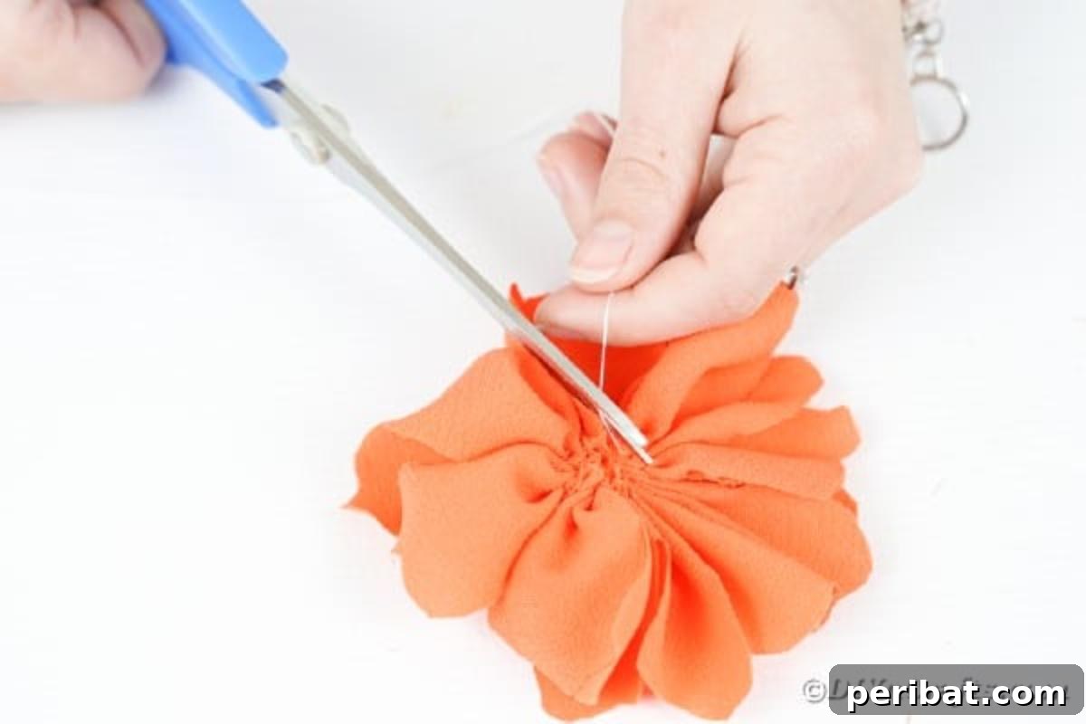 Your Easy Guide to Fabric Flower Bouquets Video 14 Trimming excess thread from the newly formed fabric flower