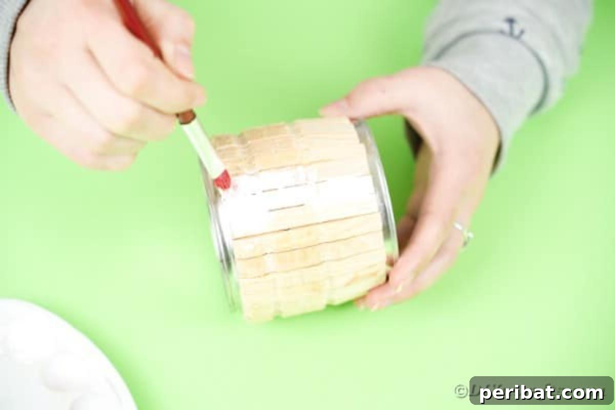 Pegged Tin Pot & Storage 12 Painting the glued clothespins on the tin can with craft paint