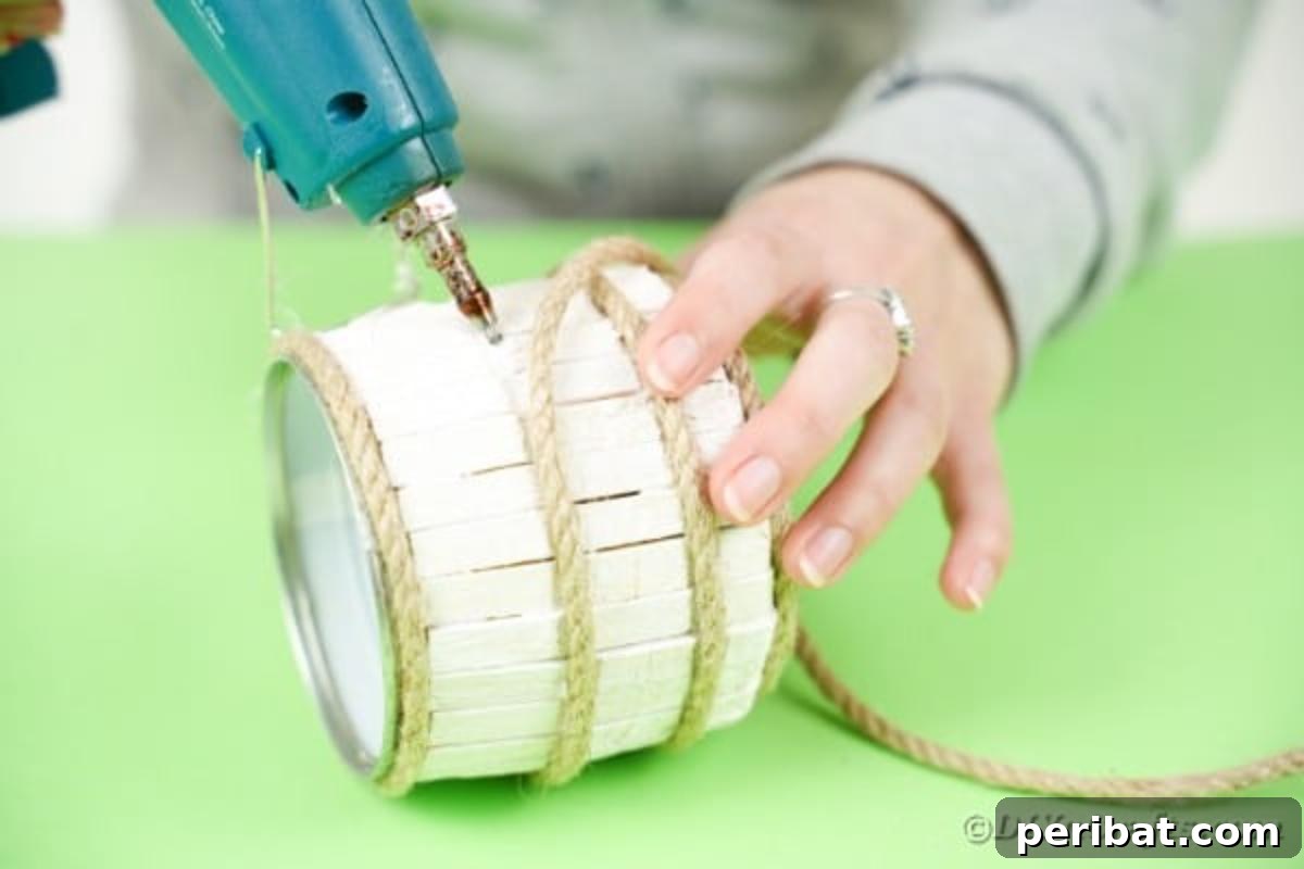 Pegged Tin Pot & Storage 13 Gluing decorative rope bands onto the painted clothespin tin can