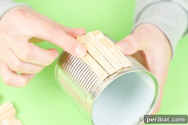 Pegged Tin Pot & Storage 18 Gluing clothespins on tin can
