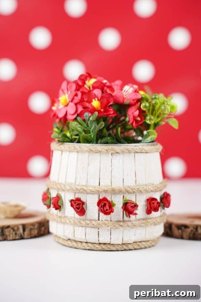 Pegged Tin Pot & Storage 28 Clothespin barrel tin can displayed against a whimsical red polka dot background