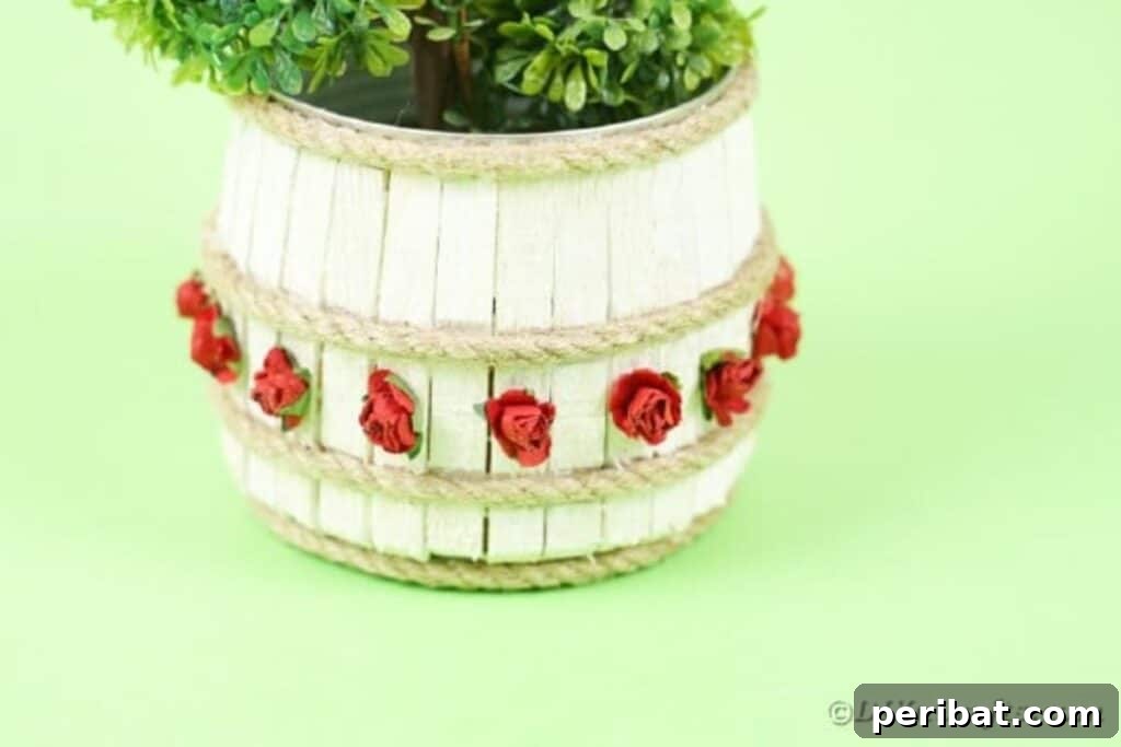 Pegged Tin Pot & Storage 32 Clothespin organizer can with thriving green plants, perfect for indoor gardening