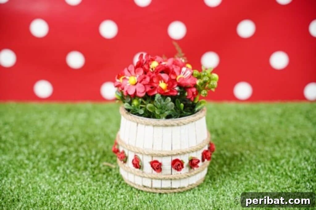Pegged Tin Pot & Storage 35 Clothespin tin can organizer on grass with a cheerful red polka dot background