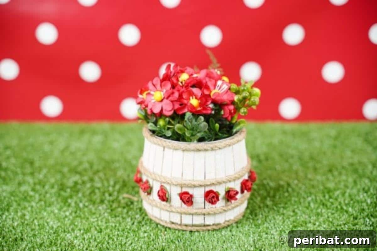 Pegged Tin Pot & Storage 7 Clothespin tin can organizer on grass with a vibrant red polka dot background