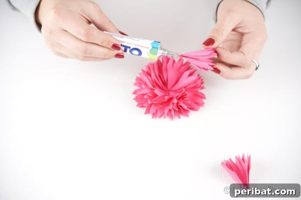 Adding final bit of folded paper to flower