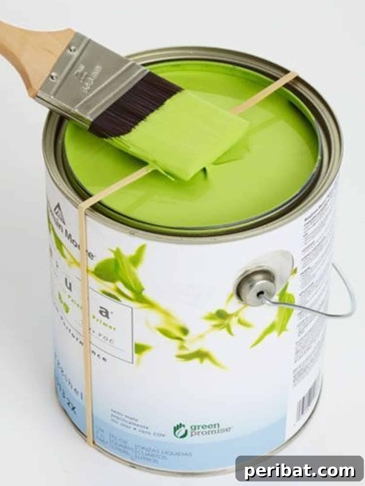15 Smart Rubber Band Tricks for an Easier Everyday 11 Rubber band stretched across a paint can to scrape excess paint from a brush
