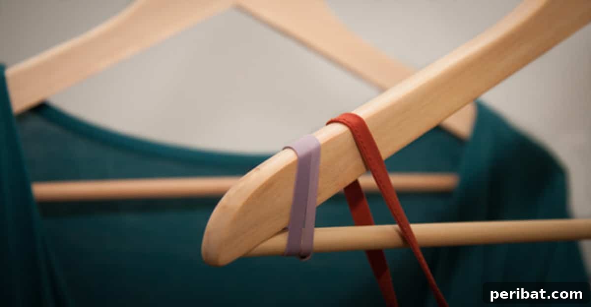 15 Smart Rubber Band Tricks for an Easier Everyday 3 Hanger with rubber bands to stop clothes from slipping