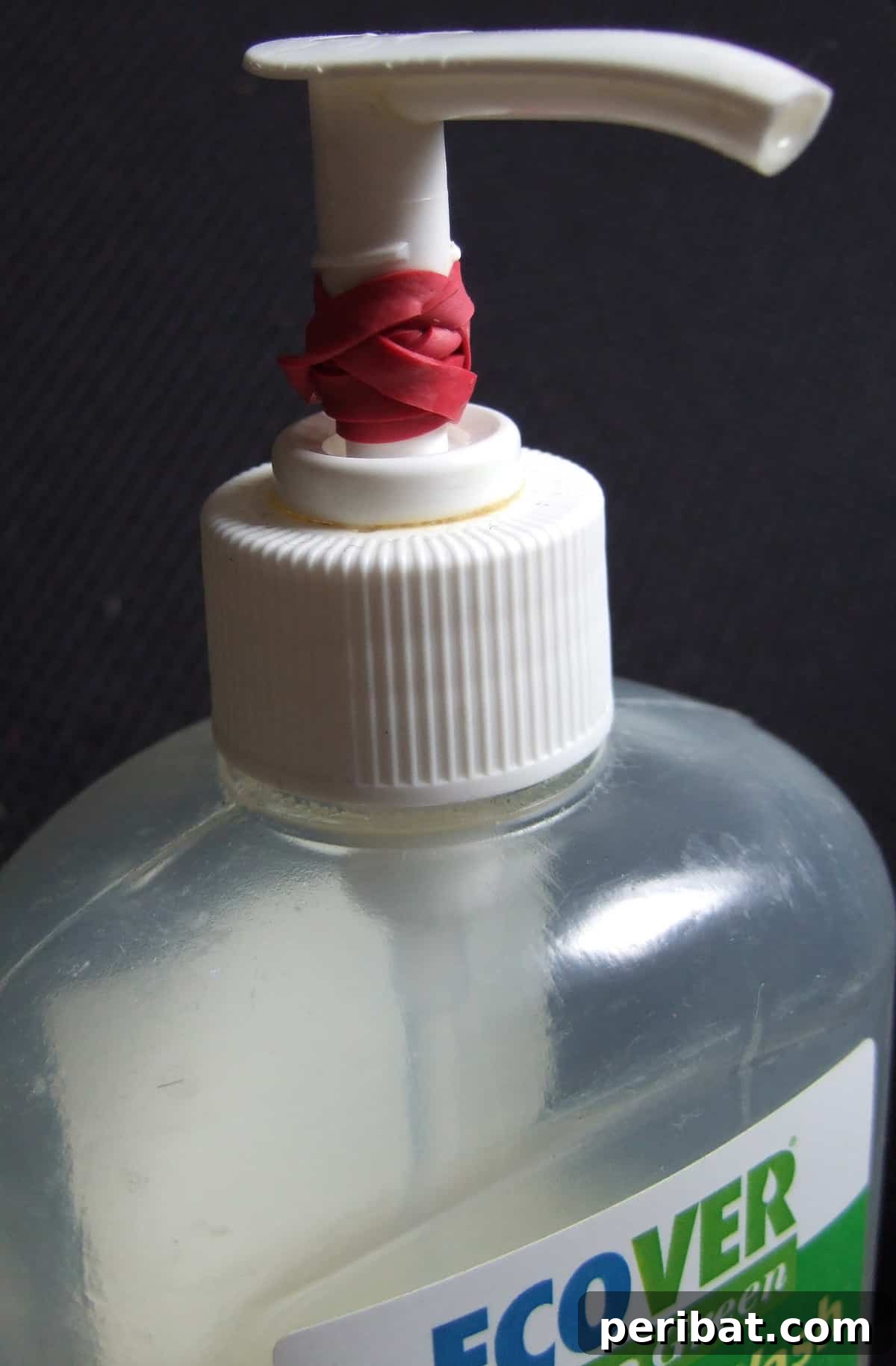 15 Smart Rubber Band Tricks for an Easier Everyday 9 Rubber band limiting the pump action of a soap dispenser