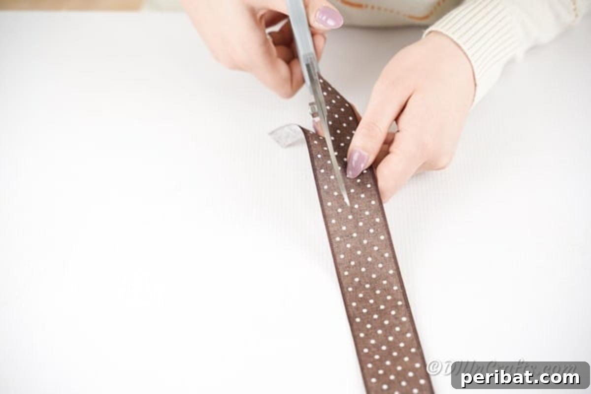 Chic Burlap Lace Accent Canister 11 Person cutting a piece of wide ribbon to fit around the top of a decorative storage can