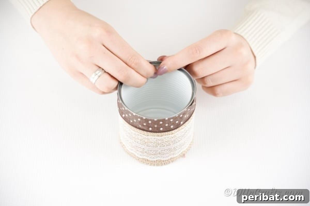 Chic Burlap Lace Accent Canister 12 Attaching wide satin ribbon to the top of a tin can with glue