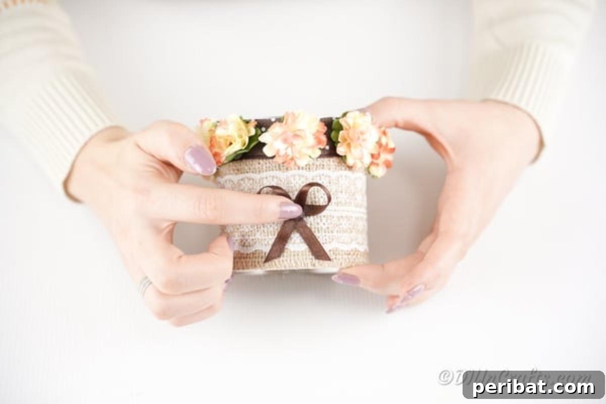 Chic Burlap Lace Accent Canister 14 Adding a small ribbon bow to the front of the storage can