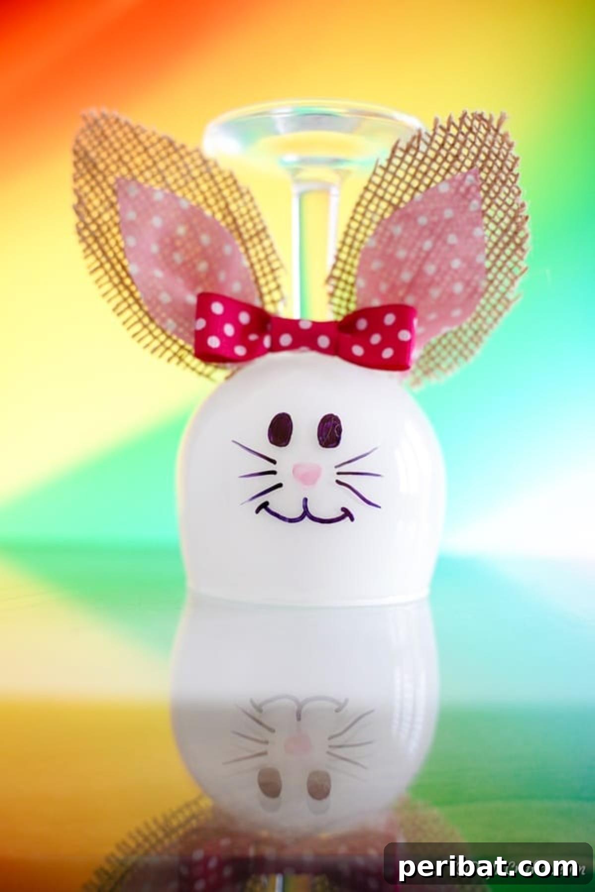 Hoppy Wine Glass Bunny Decor Tutorial 17 The completed wine glass bunny decoration standing proudly in front of a pastel background.