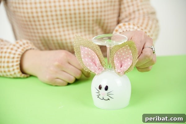Hoppy Wine Glass Bunny Decor Tutorial 26 Gluing ears on glass