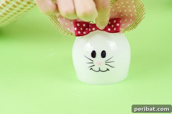 Hoppy Wine Glass Bunny Decor Tutorial 27 Adding bow to bunny glass