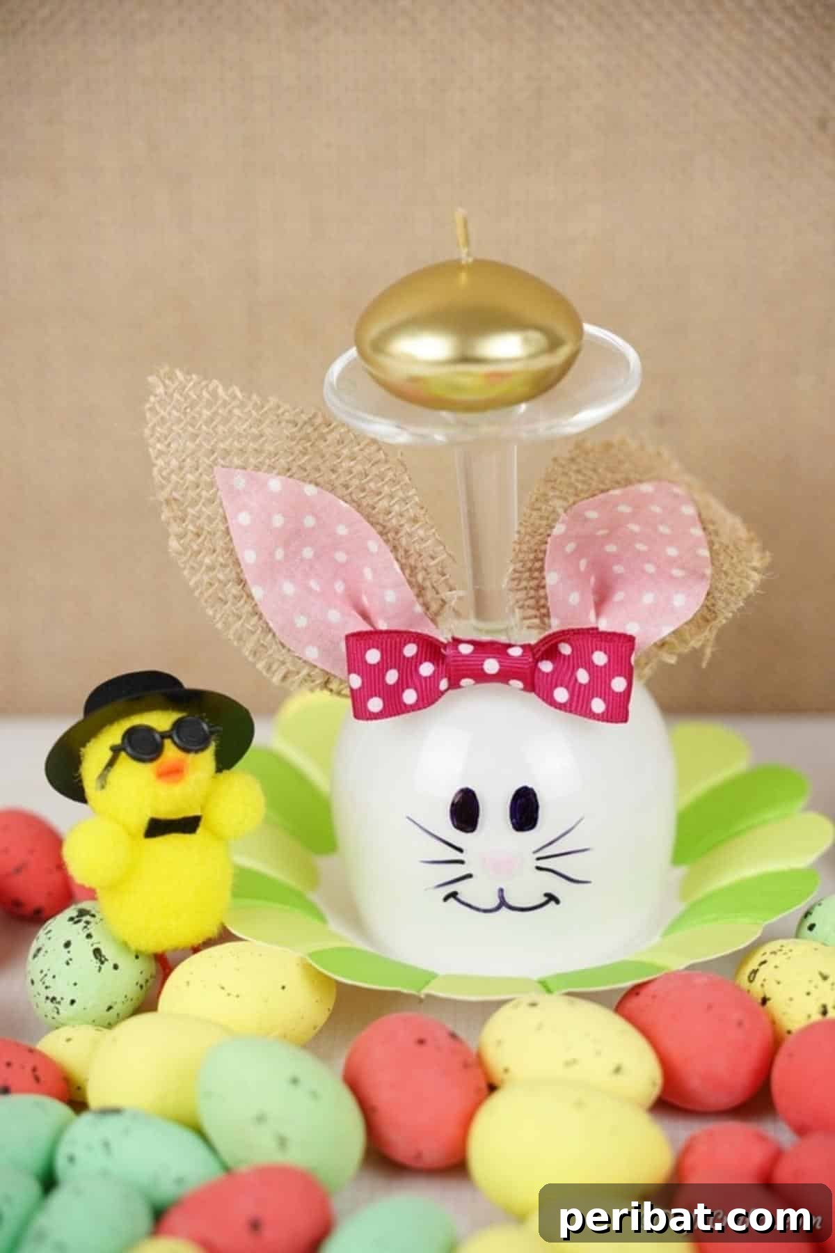 Hoppy Wine Glass Bunny Decor Tutorial 5 A wine glass bunny decoration surrounded by various Easter decorations.