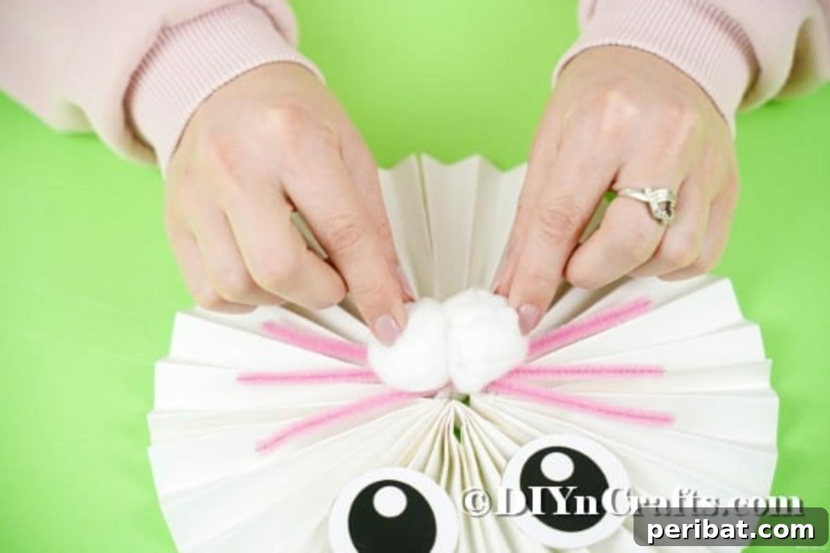 Gluing the paper bunny face in place