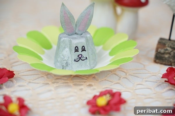 A small logo or icon representing the DIY craft blog, often seen at the bottom of craft cards.