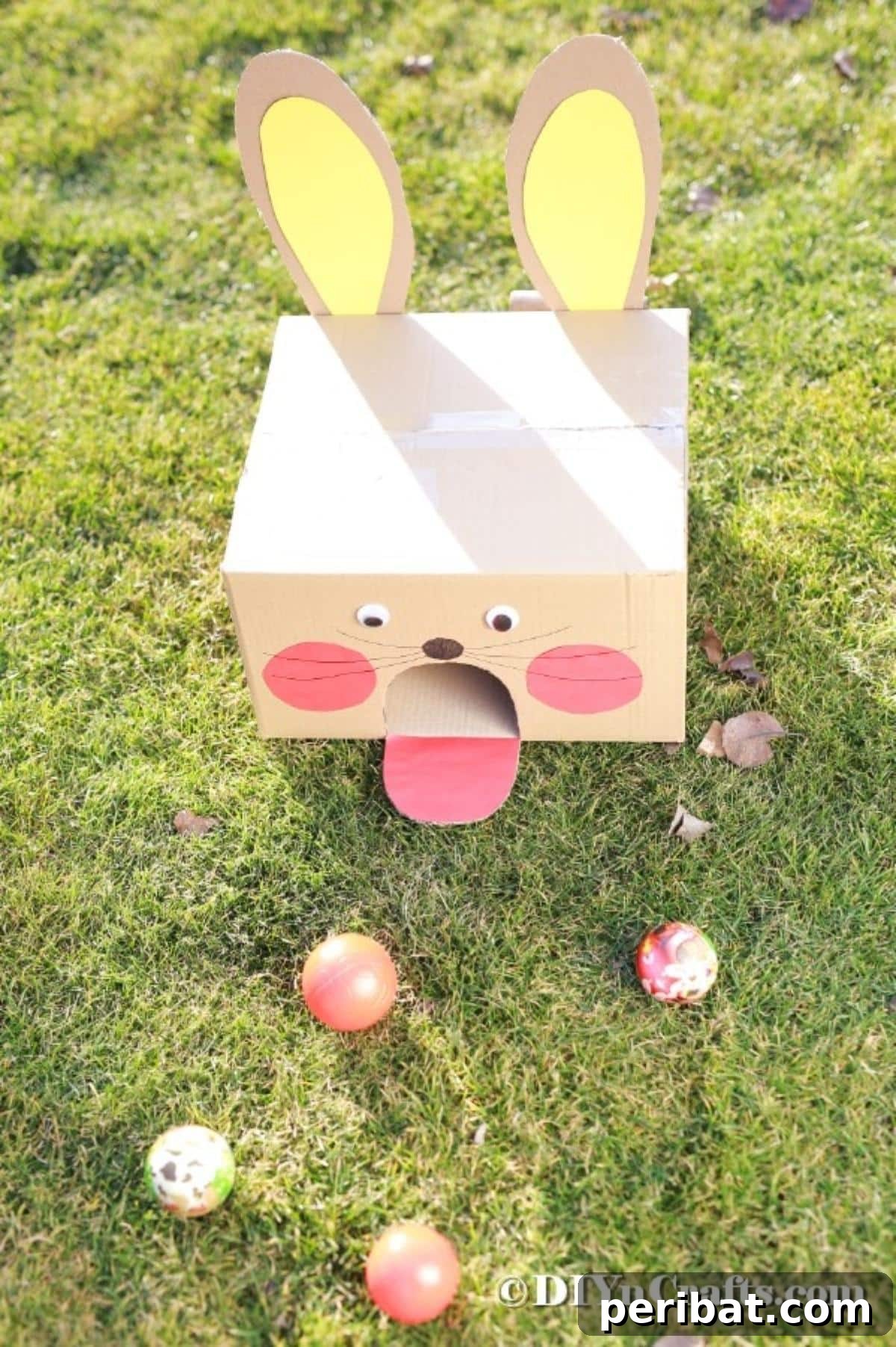 Hoppy Easter Box Ball Toss 20 The completed Easter bunny ball toss game ready for play on grass.