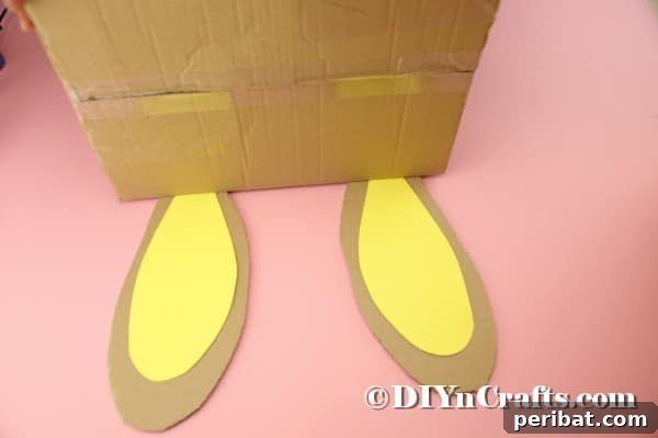 Hoppy Easter Box Ball Toss 34 Gluing ears onto cardboard box