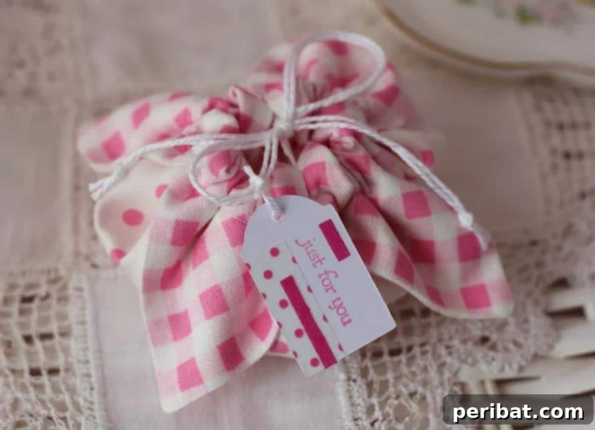 A collection of colorful DIY fabric gift pouches, tied with ribbon, offering a reusable and eco-friendly wrapping alternative for presents.