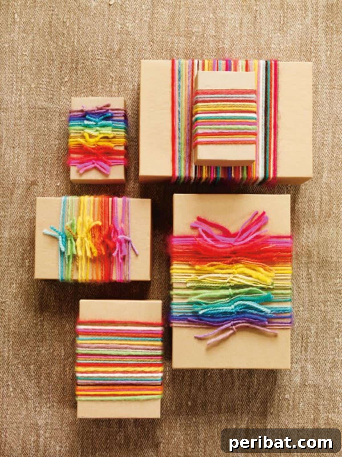 A stack of beautifully wrapped gifts, each adorned with an array of colorful yarn wrapped in rainbow patterns, creating a vibrant and eye-catching display.