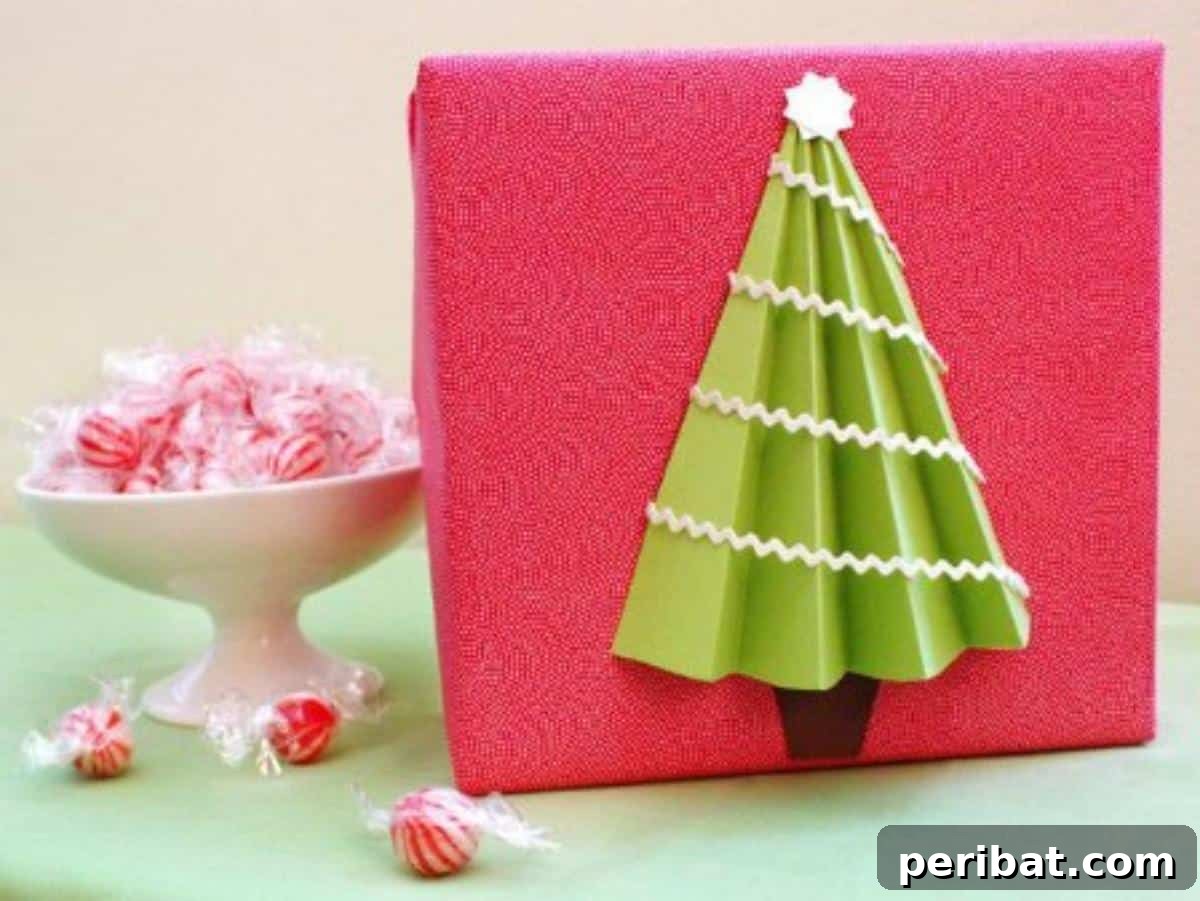 A creatively wrapped gift topped with a simple yet elegant 3D Christmas tree made from folded green paper, adding a festive and whimsical touch.