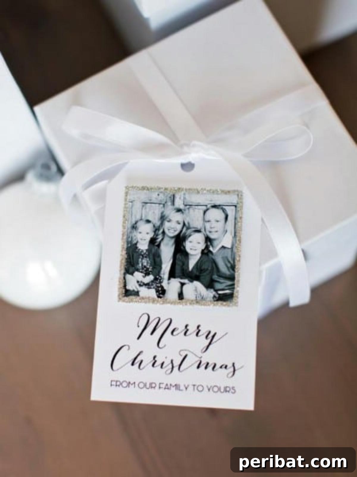 Customizable printable family gift tags with space to add a cherished photo, displaying a festive 'Merry Christmas From Our Family to Yours' message.