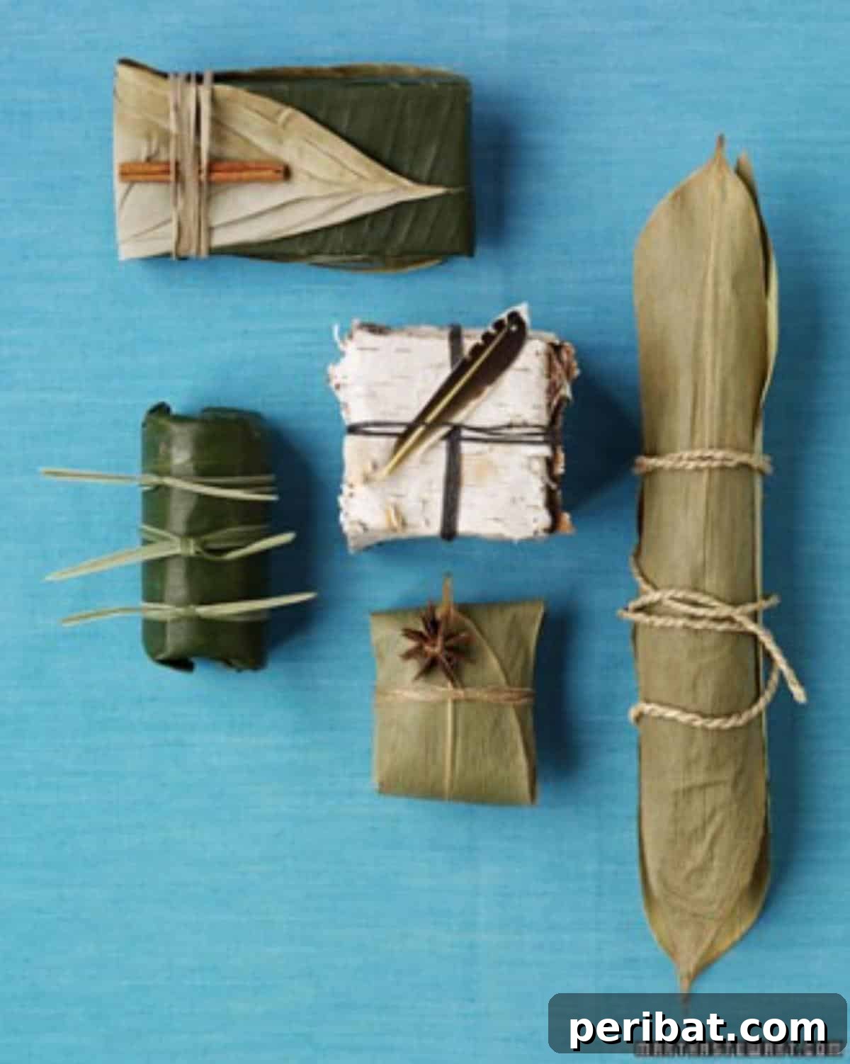 A small gift delicately wrapped in a large, flexible natural leaf and secured with rustic twine, adorned with a sprig of pine and berries for an eco-friendly and natural presentation.