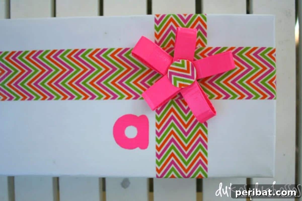 A creatively wrapped gift box featuring decorative duct tape in vibrant patterns and colors, serving as both a secure closure and a unique design element.