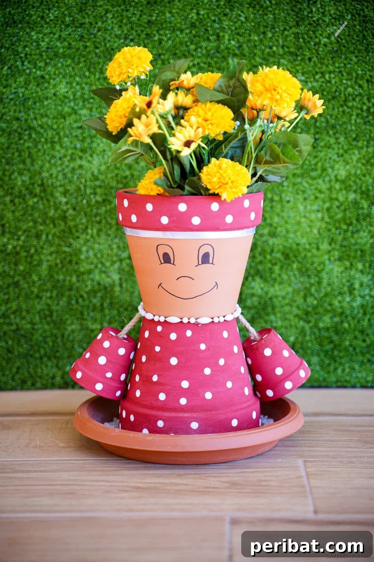 Charming Flower Pot Girl Displayed on a Table Against Green Grass