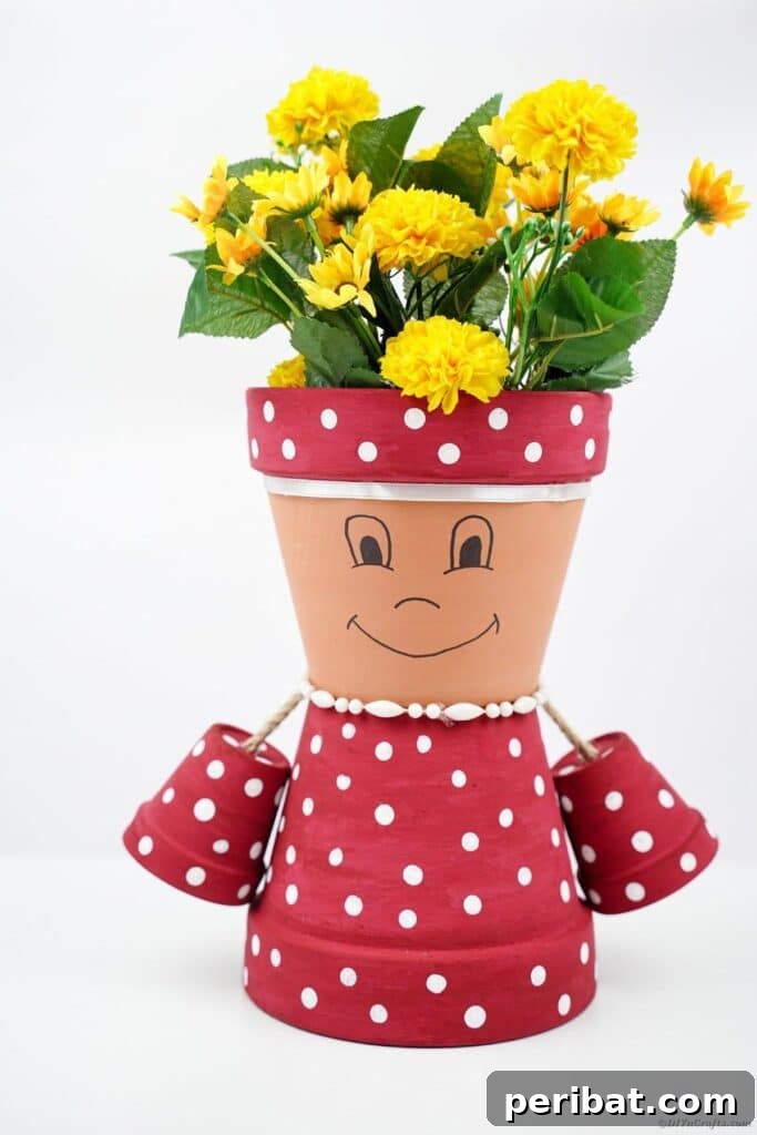 Polka dot flower pot lady in front of a clean white background