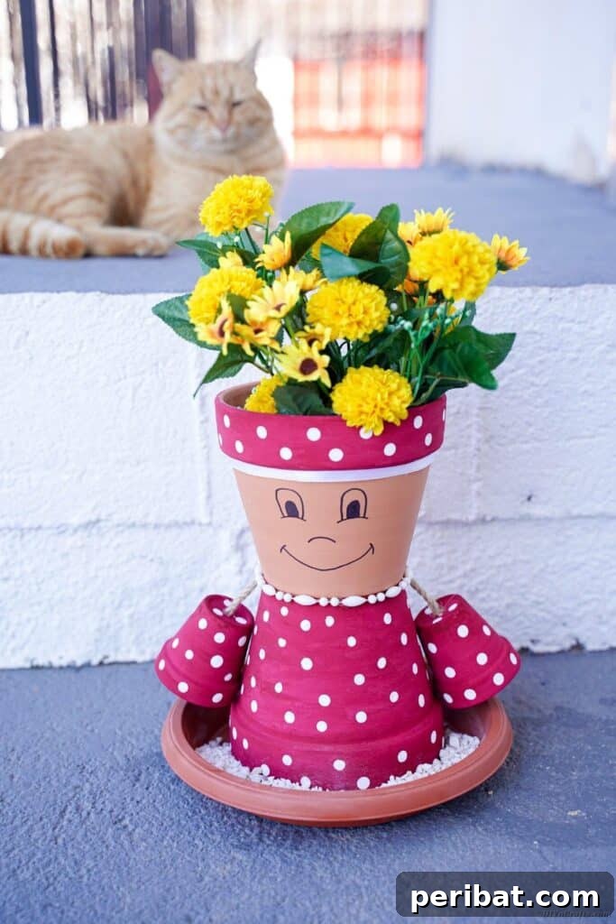 Flower pot girl figure placed by an outdoor brick wall